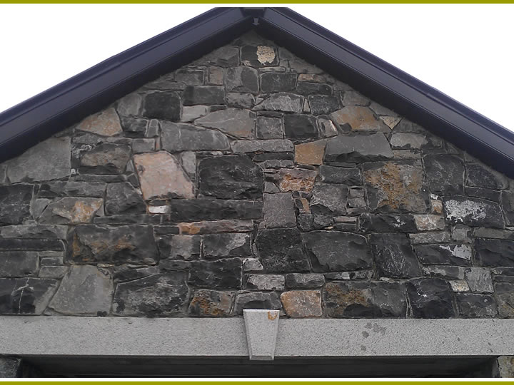 Stone.Garage.With.Cutstone.Archway.Cladding.4