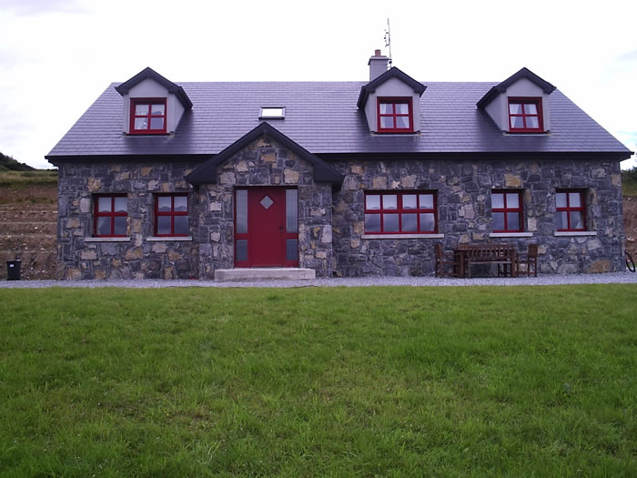 Limestone.Cladding.House.Red.Windows1.700.by.525