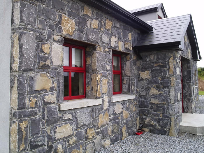 Limestone.Cladding.House.Red.Windows4.700.by.525